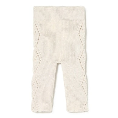 Cream-colored ribbed baby leggings on a white background