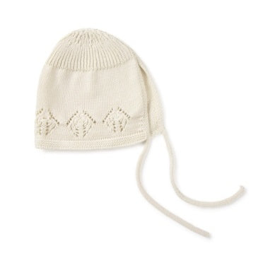 Knitted baby hat with a pattern on a white background