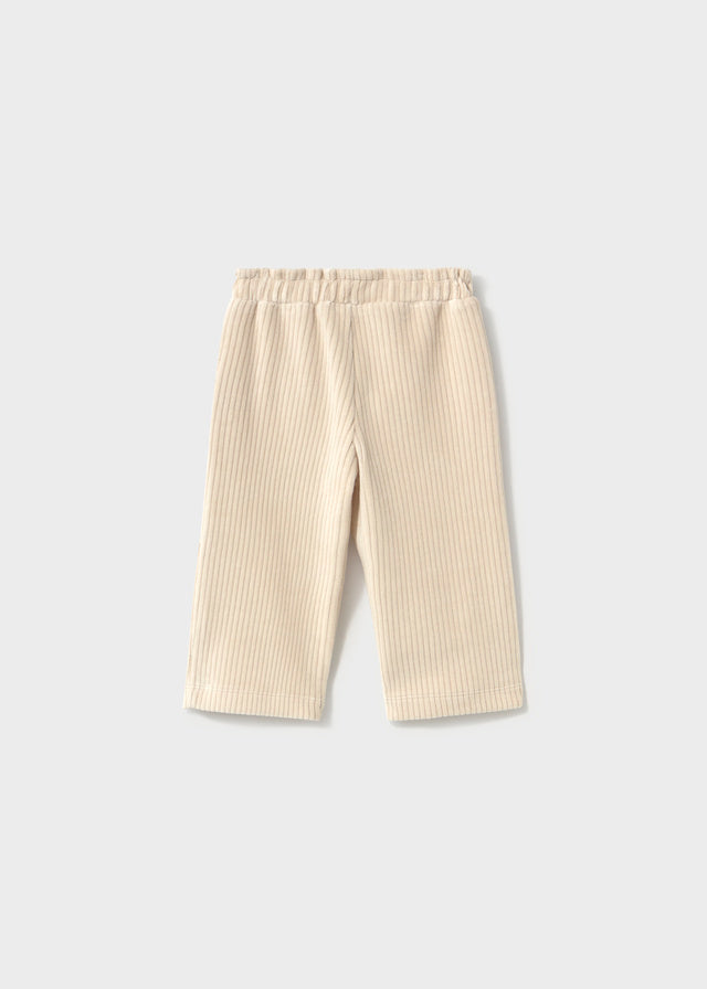 Beige striped pants on a light gray background