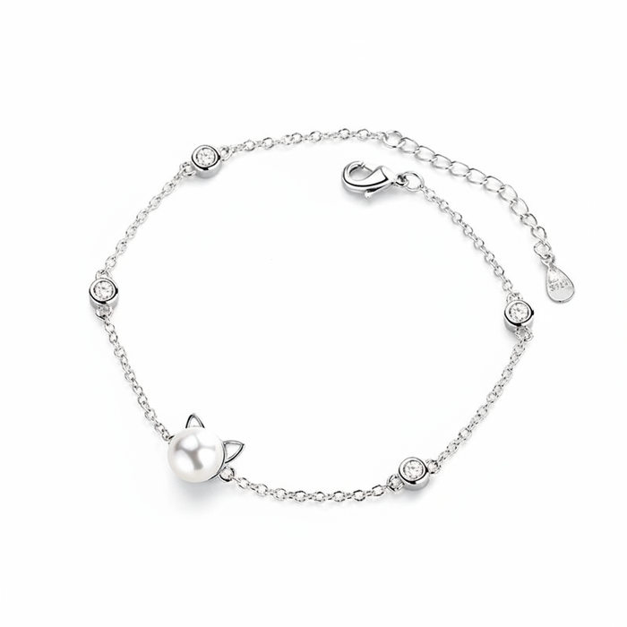 Sterling silver delicate link chain bracelet featuring a cat-shaped pearl charm and shimmering round-cut zirconia accents.