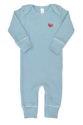 Blue baby onesie with a red airplane on a white background