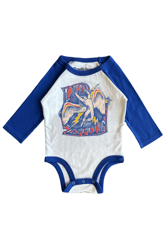 Baby onesie with blue sleeves and colorful graphic on a white background