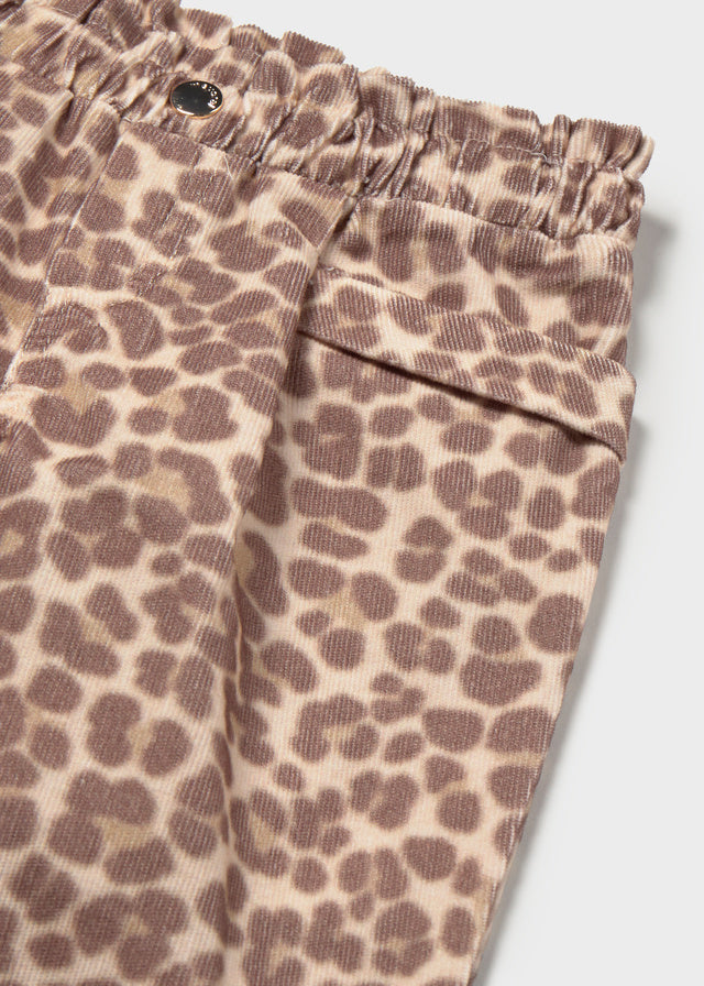Leopard print pants with an elastic waistband on a light background