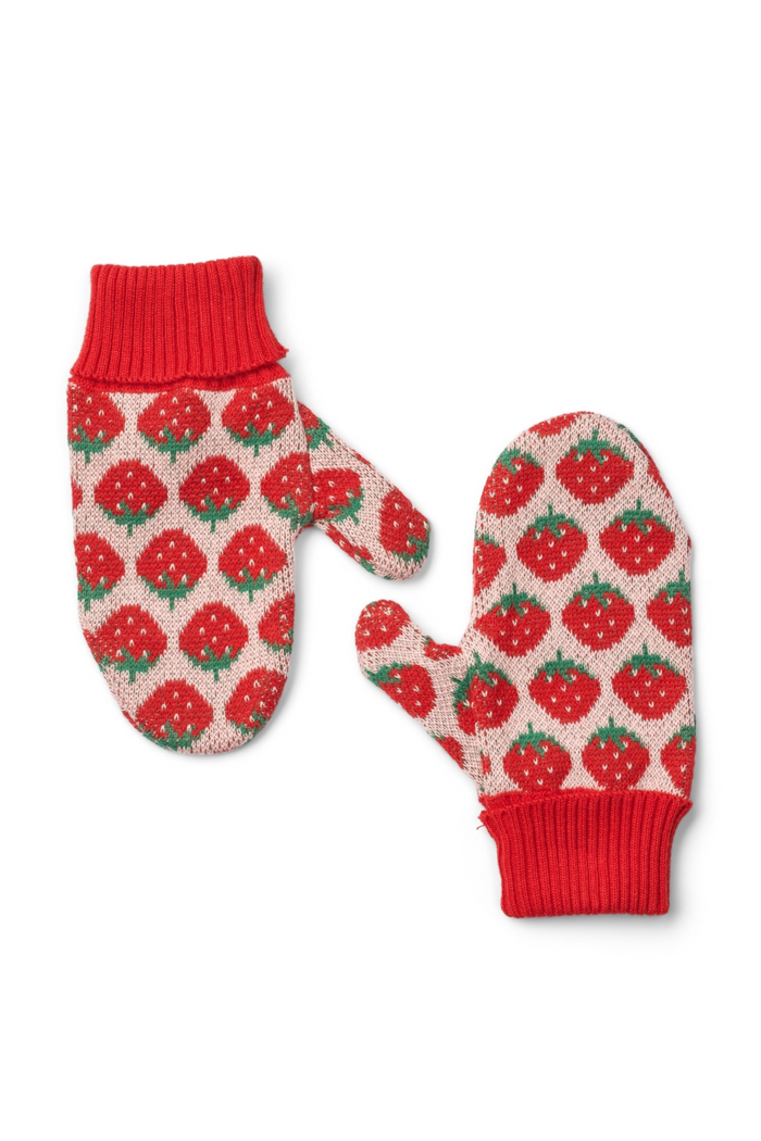 A pair of knit winter mittens with a red and green strawberry pattern on a cream background, featuring solid red ribbed cuffs.
