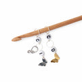 Butterfly crochet increase and decrease counter set with letter beads and silver and gold butterfly charms on wooden crochet hook