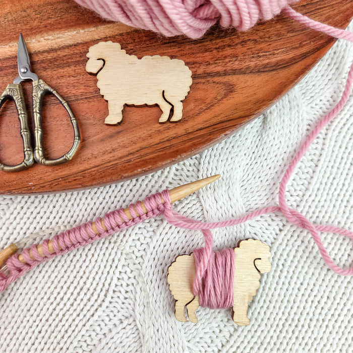 Colorful crochet tapestry swatch with sheep yarn bobbins and Storybook Doodle Deck chart cards including Goldilocks, Porridge, and Mama Bear patterns