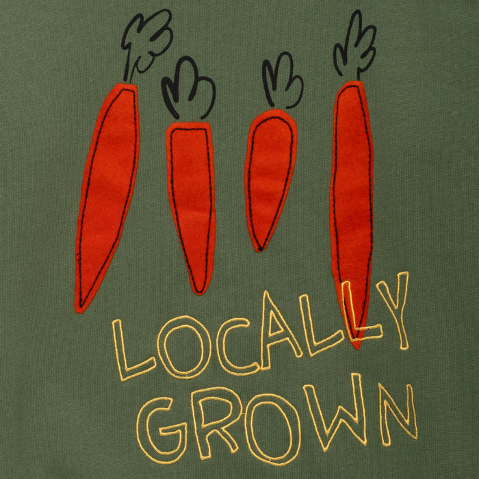 Green shirt with red carrots and 'Locally Grown' text on a green background