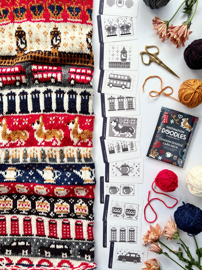 London Doodle chart cards beside a red, navy and cream London colorwork knit