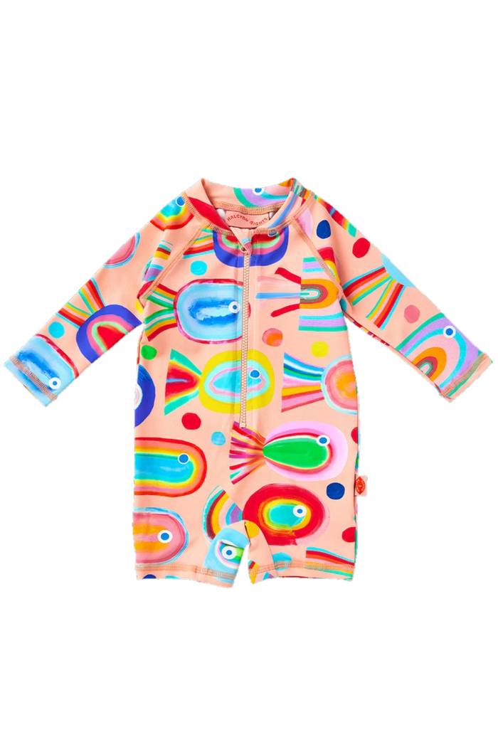 Colorful children's swimsuit with fish and polka dot pattern on a white background