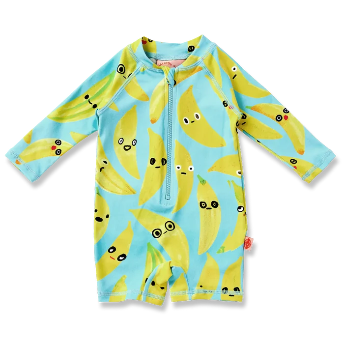 Children's swimsuit with banana pattern on a light blue background