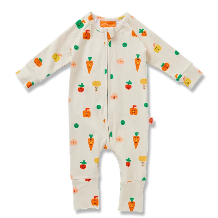 Baby onesie with vegetable patterns on a white background