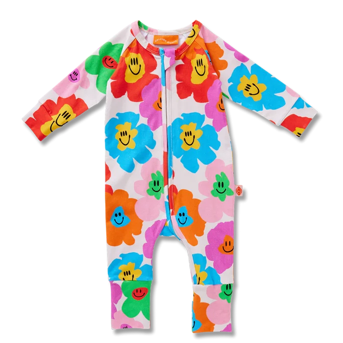 Colorful baby romper with floral patterns on a white background