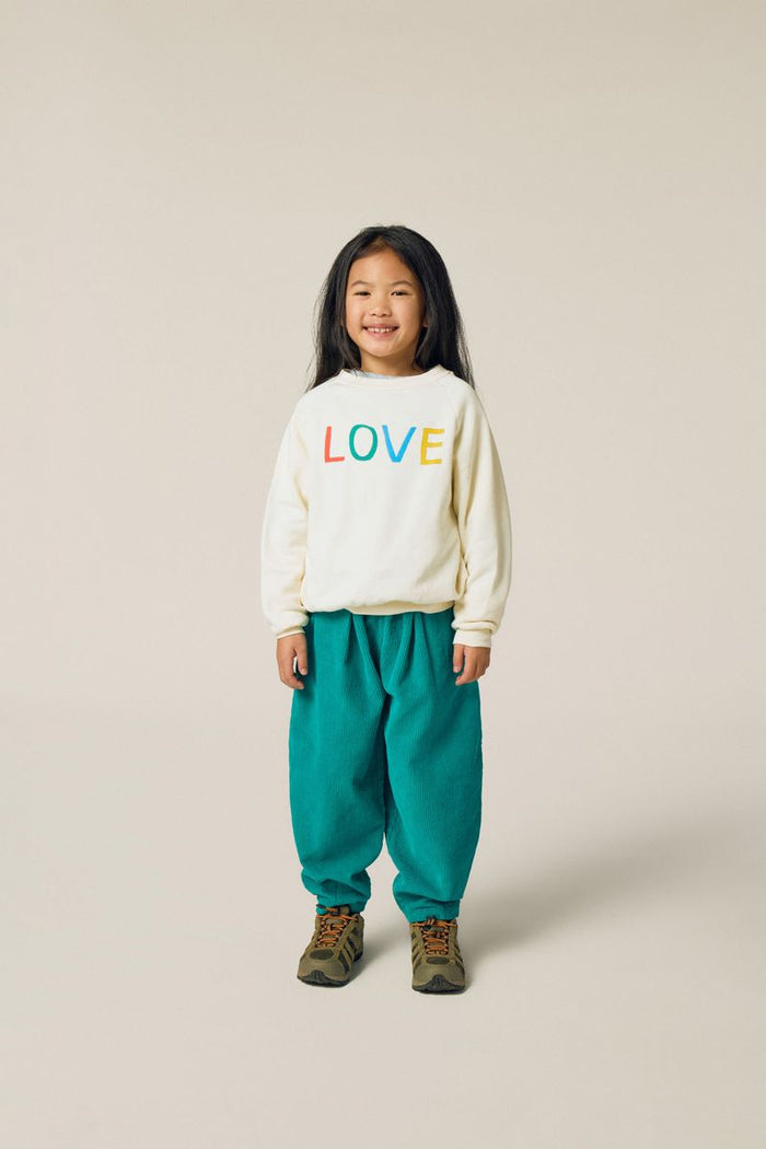 Child wearing Love Sweatshirt