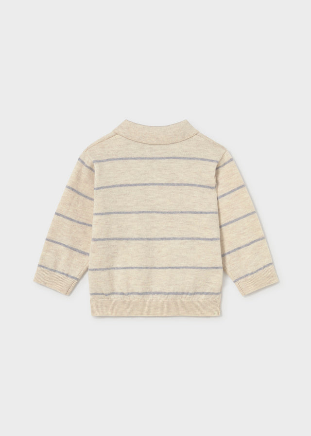 Beige and blue striped sweater on a white background