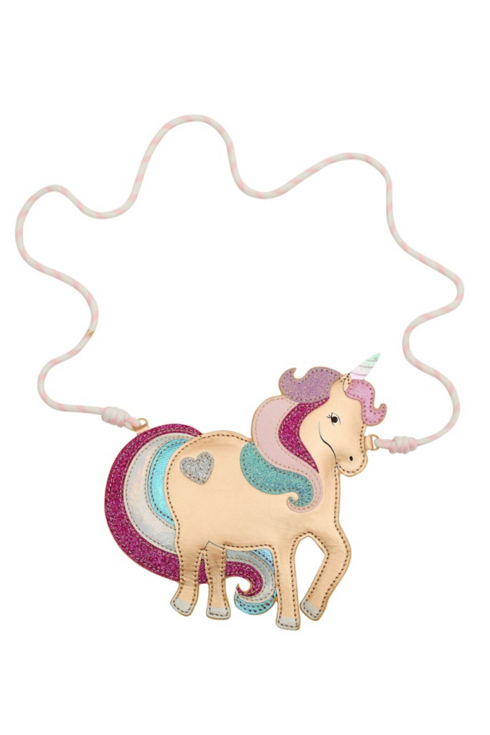 A unicorn-shaped purse, featuring a gold body with pink, purple, teal, and white accents, shown on a plain white background.
