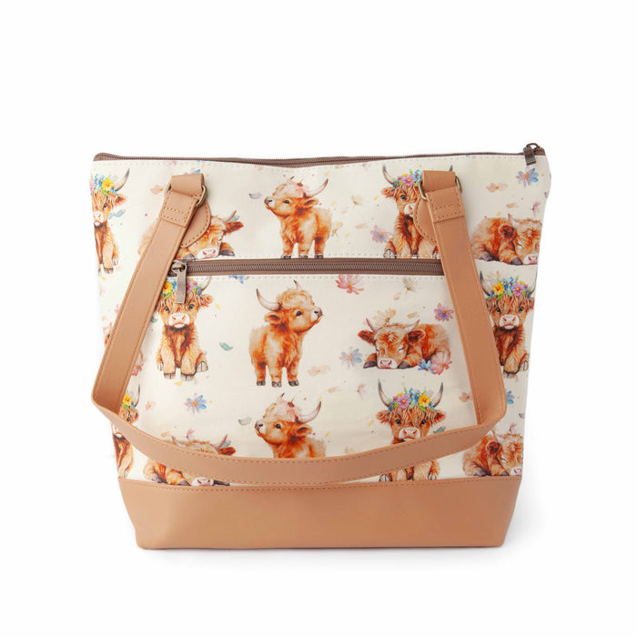 Maisy Highland Cow Mega Trinity Bag large zippered project bag showing highland cow floral fabric with leather trim front view