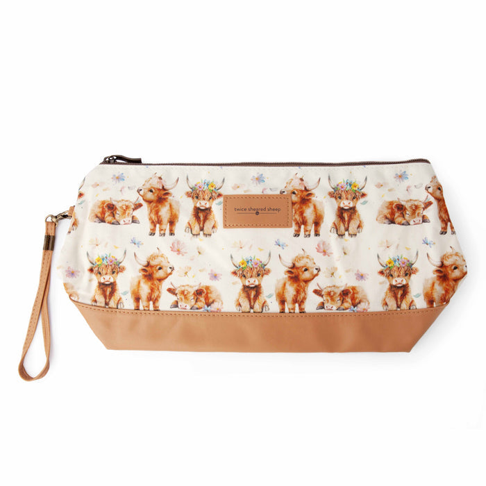 Maisy Highland Cow Trinity Bag in medium size showing a zippered knitting project bag with highland cow print fabric, brown faux leather base, and wrist strap