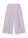 Light purple wide-leg cropped pants with pleated front panels and decorative white trim along the waistband and pocket edges, shown flat against a white background.