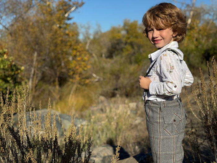 child wearing pants with suspenders