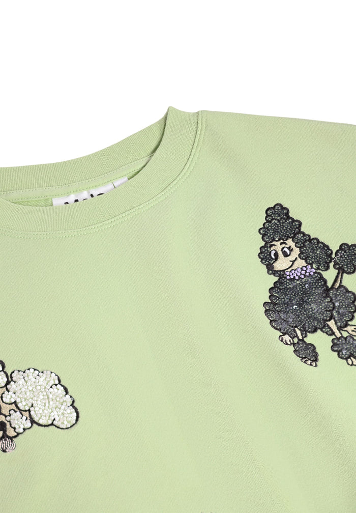 Light green sweatshirt with black poodle design on a white background