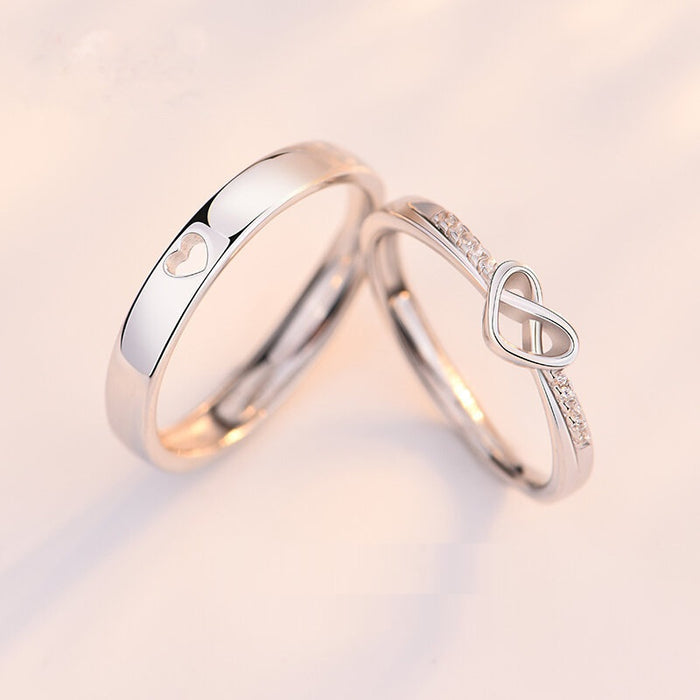 Minimalist platinum-tone heart-shaped matching couple rings for men and women, elegant promise ring set.