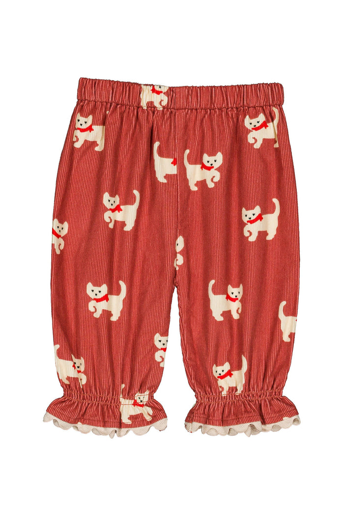 corduroy pants with an all-over print of white cartoon cats wearing red bows, featuring an elastic waistband and ruffled cuffs.