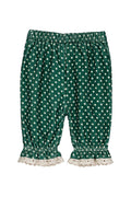 Green and white polka dot pants with a ruffled lace hem, shown flat on a white background.