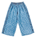Light blue denim cropped pants with a white floral print and ruffled trim along the sides, shown flat on a white background.