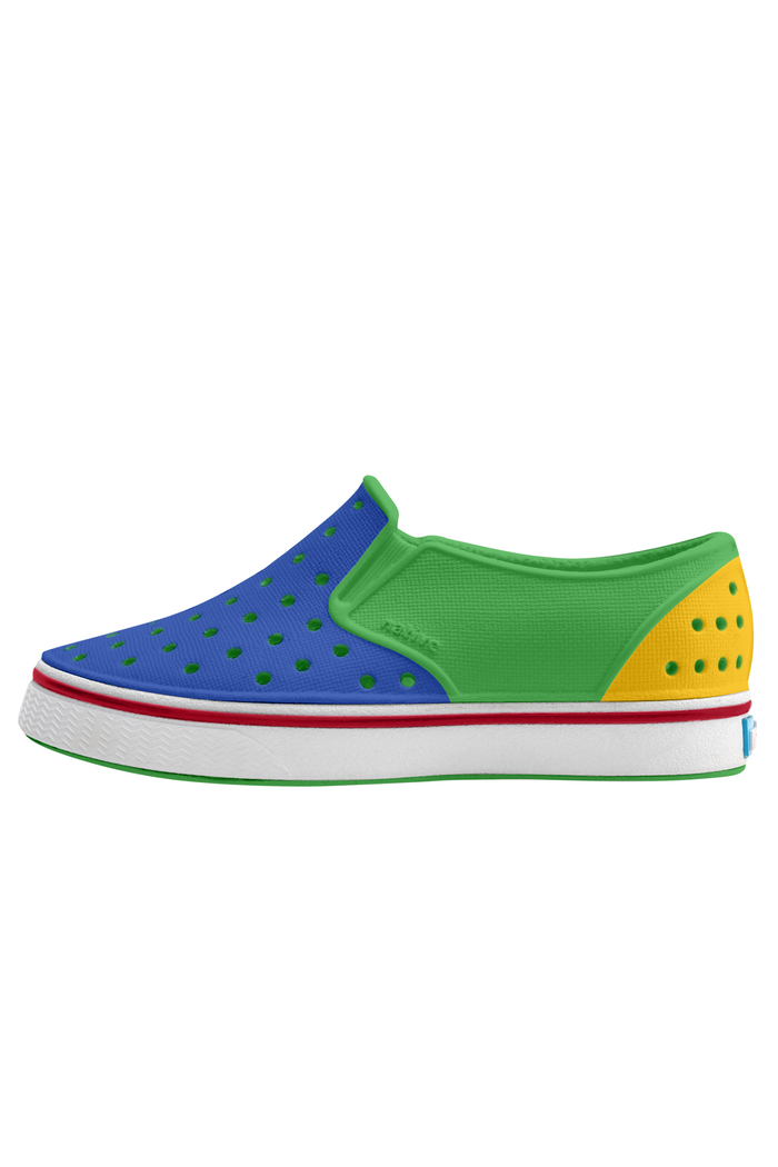 Colorful children's shoe with blue, green, yellow, and red accents on a white background