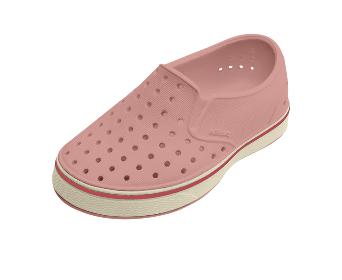 Pink clog shoe with white sole on a white background