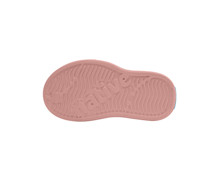 Pink sole of a shoe on a white background