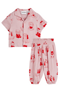 Children's set with red animal prints on a pink background