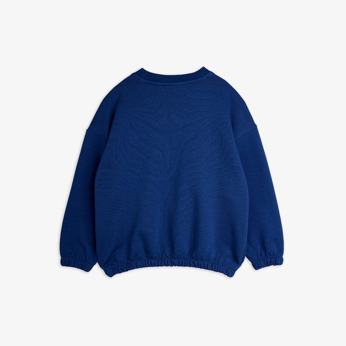 Blue sweater on a light gray background