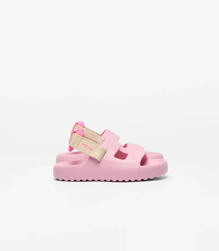 Pink sandal with a beige strap on a white background