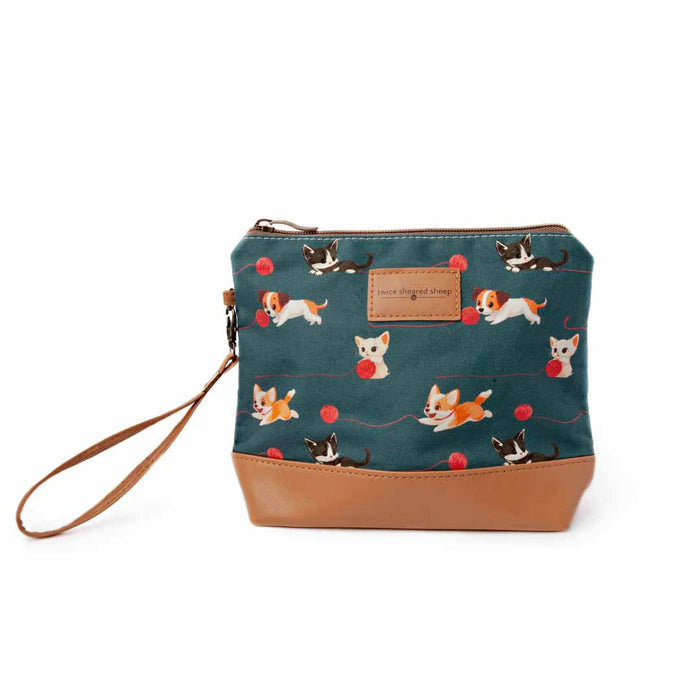 Cats and Dogs Mini Trini Bag small zippered sock project bag with teal fabric featuring playful kittens, corgis, and beagles chasing red yarn balls, tan vegan leather bottom, and wrist strap
