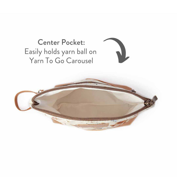 Maisy the Highland Cow Mini Trini Bag interior view from above showing the cream cotton lining center pocket with annotated text about holding a yarn ball on Yarn To Go Carousel