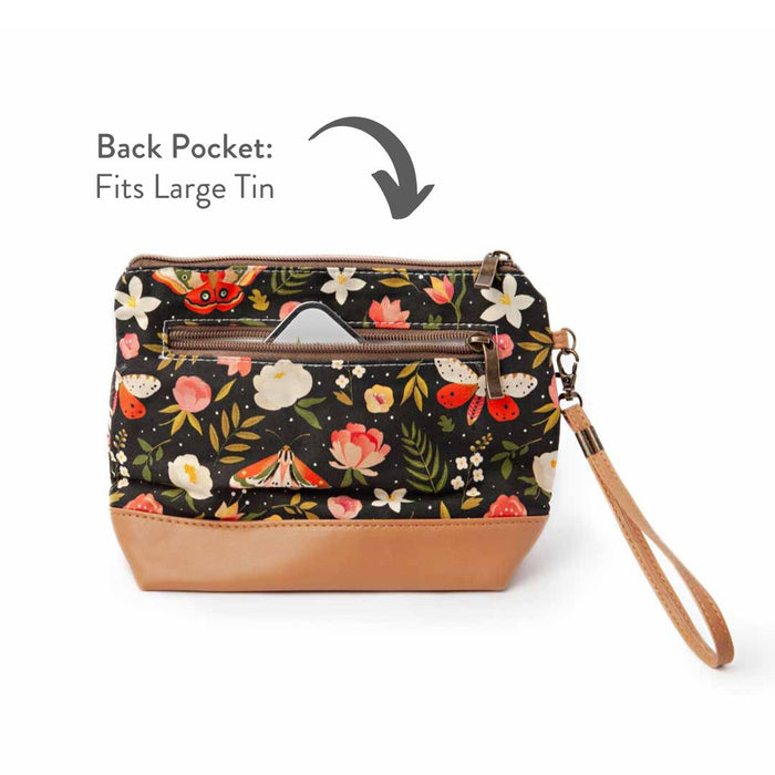 Night Forest Mini Trini Bag back view showing the zippered exterior pocket partially open with a storage tin visible and annotated text reading Back Pocket Fits Large Tin