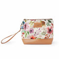 Spring Floral Mini Trini Bag small zippered sock project bag with watercolor pink, purple, and coral floral print on cream fabric, tan vegan leather bottom, and wrist strap