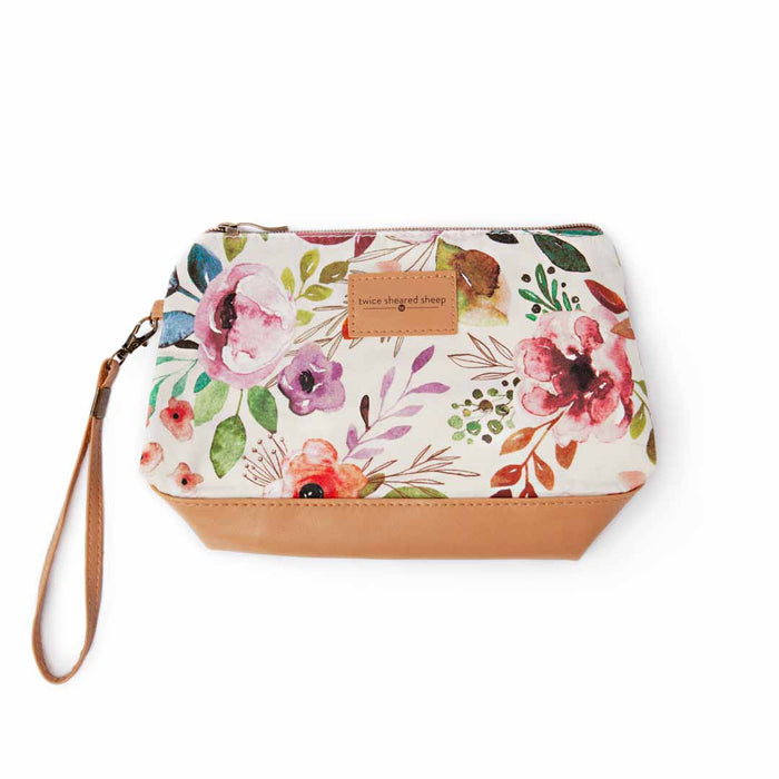 Spring Floral Mini Trini Bag top-down view showing the watercolor floral print on cream cotton canvas with tan vegan leather bottom and wrist strap