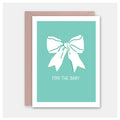 Greeting card with a white bow on a teal background and 'For the Baby' text.