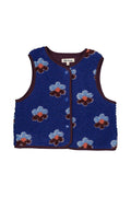 A sleeveless blue fleece vest with a floral pattern of light blue, dark brown, and orange flowers, featuring dark brown trim and a front zipper.