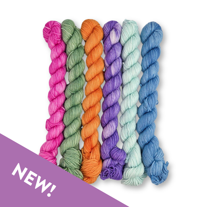 Set of colorful yarn skeins on a white background with 'NEW!' label.