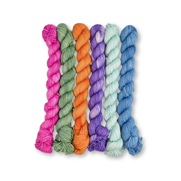 Molly Klein Design Sweet Sock fingering weight mini skein yarn pack in Tidal Treasures — six coordinating ocean-inspired colorways arranged together
