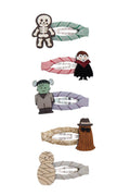 Set of Halloween-themed hair clips on a white background