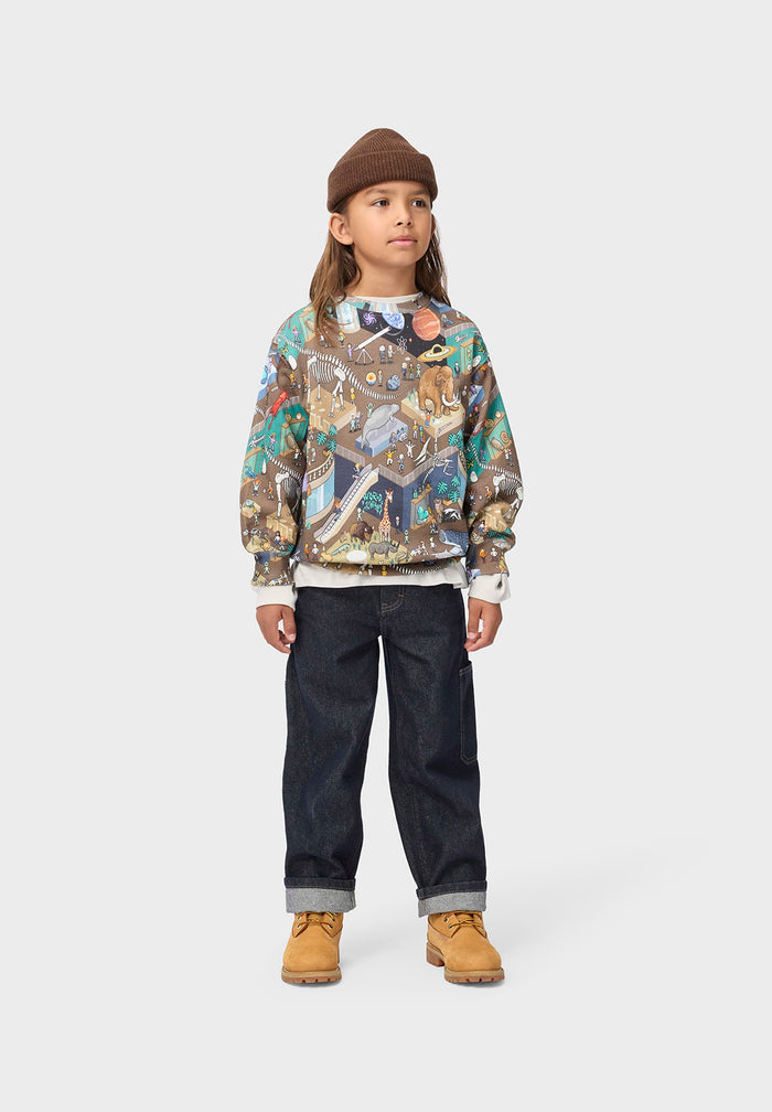 Child wearing a patterned hoodie, dark pants, and brown boots on a white background