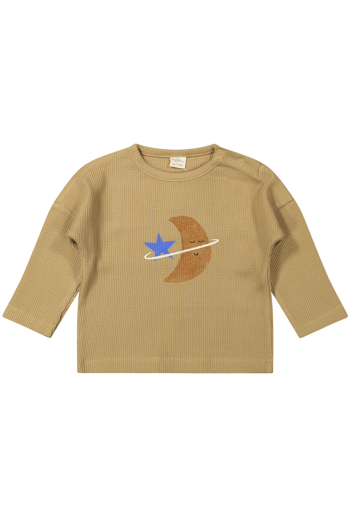 Beige long-sleeve shirt with a moon and star design on a white background