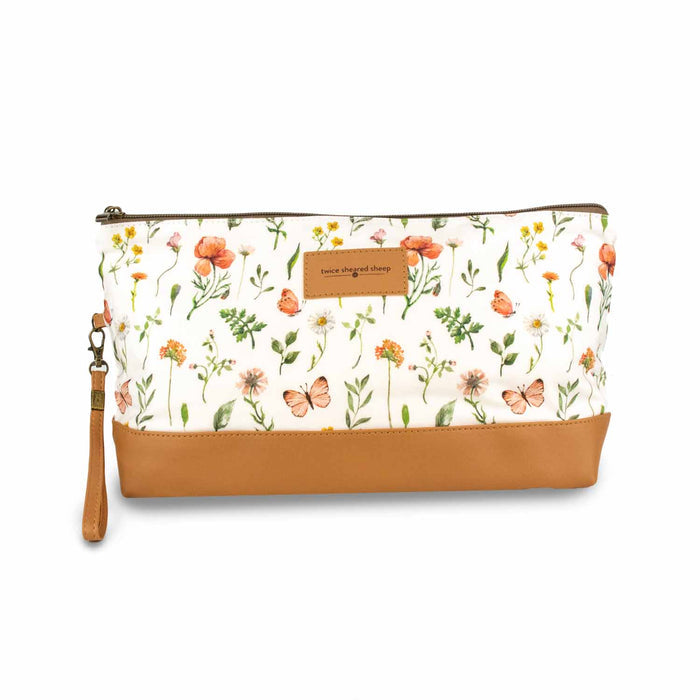 Mountain Meadow Trinity Bag medium zippered knitting project bag with wildflower and butterfly print fabric, tan faux leather bottom, zipper, and wrist strap