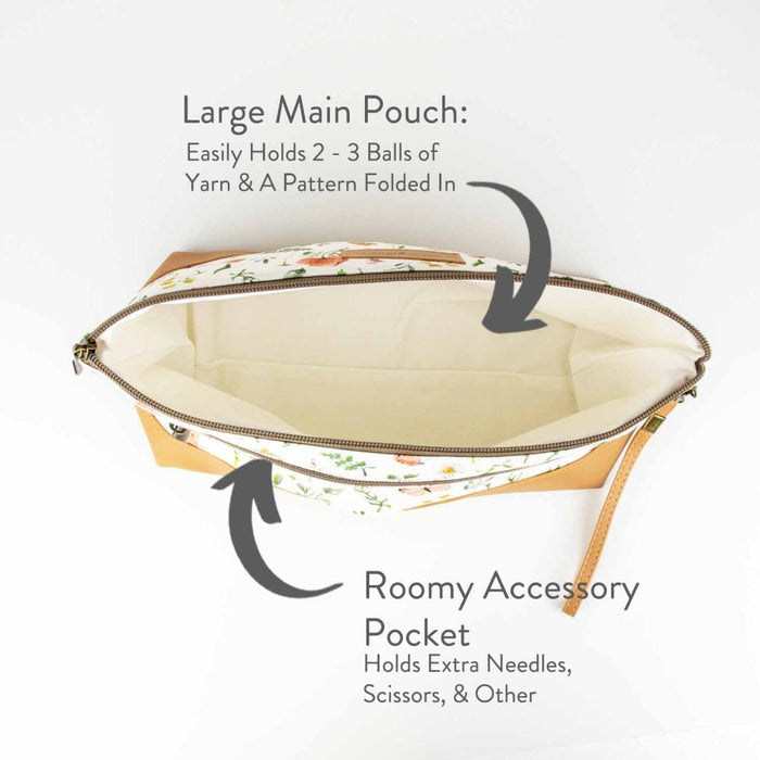 Mountain Meadow Trinity Bag open showing the large main pouch with cream lining and labeled roomy accessory pocket for needles and scissors