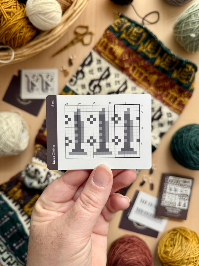 Hand holding a Music Doodle clarinet colorwork chart card