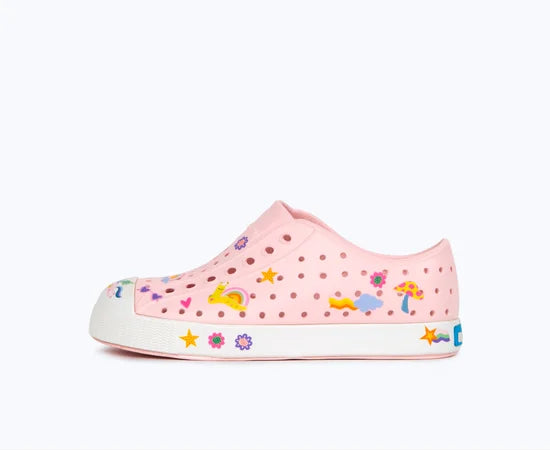 Pink children's shoe with colorful designs on a white background